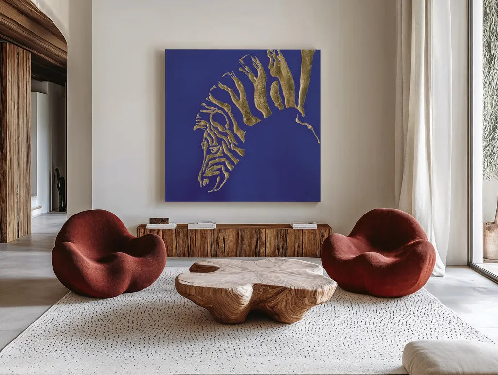 Gilded Zebra Indigo by Chris Paschke. Shown as extra-large giant wall art in a modern living room. Available as an archival giclee rolled canvas, fine art paper, or poster print. SKU 41920a.