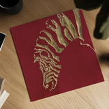 Gilded Zebra on Red by Chris Paschke. Shown as a detailed flat fine art print, highlighting archival giclee quality. Available as an archival giclee rolled canvas, fine art paper, or poster print. SKU 41925a.