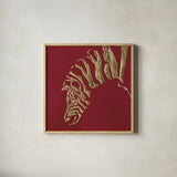 Gilded Zebra on Red by Chris Paschke. Shown in a natural wood glass frame for a timeless modern aesthetic. Available as an archival giclee rolled canvas, fine art paper, or poster print. SKU 41925a.