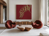 Gilded Zebra on Red by Chris Paschke. Shown as extra-large giant wall art in a modern living room. Available as an archival giclee rolled canvas, fine art paper, or poster print. SKU 41925a.
