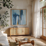 Glacier IV by Chris Paschke. Shown in a natural wood frame in a cozy modern living room. Available as an archival giclee rolled canvas, fine art paper, or poster print. SKU 68193a.