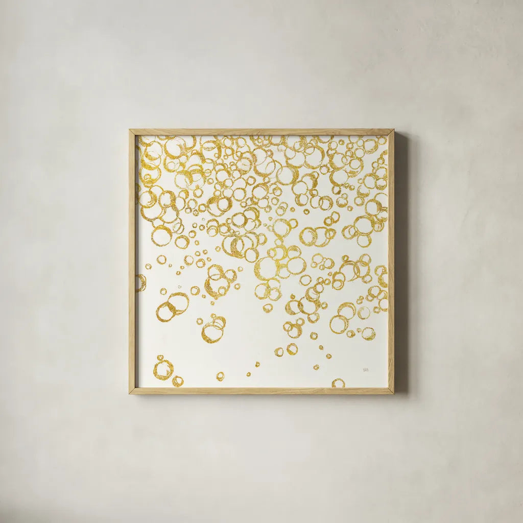 Gold Bubbles I by Chris Paschke. Shown in a natural wood glass frame for a timeless modern aesthetic. Available as an archival giclee rolled canvas, fine art paper, or poster print. SKU 68833a.