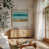 Gold Emerald IV by Chris Paschke. Shown in a natural wood frame in a cozy modern living room. Available as an archival giclee rolled canvas, fine art paper, or poster print. SKU 75472a.
