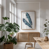 Gold Feathers III Indigo by Chris Paschke. shown as a print in a natural wood frame in a dining room. Available as a archival giclee rolled canvas, fine art paper, or poster print. SKU 26437h.