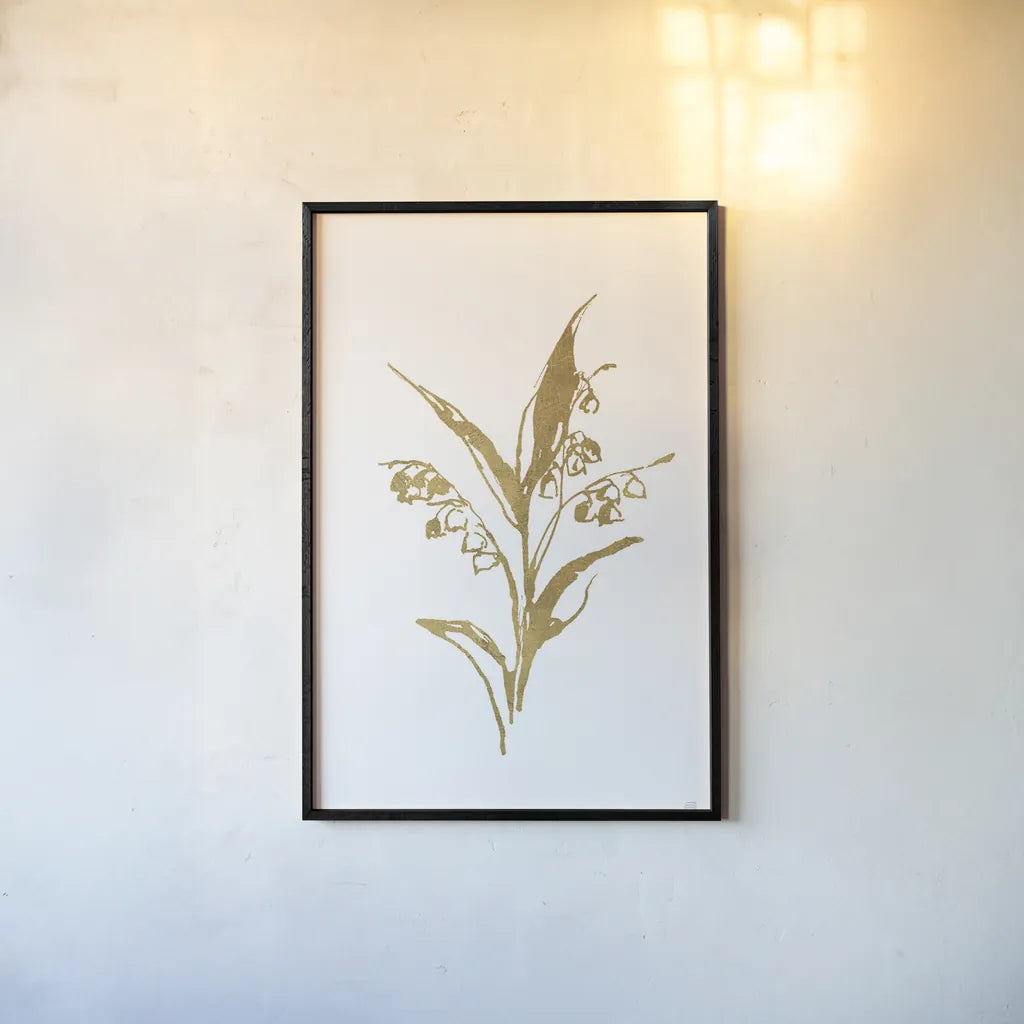 Gold Line Lily of the Valley I by Chris Paschke. shown as a paper print in a black flame. Available as a archival giclee rolled canvas, fine art paper, or poster print. SKU 69566h.