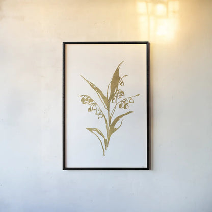 Gold Line Lily of the Valley I by Chris Paschke. shown as a paper print in a black flame. Available as a archival giclee rolled canvas, fine art paper, or poster print. SKU 69566h.