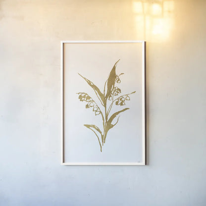 Gold Line Lily of the Valley I by Chris Paschke. shown as a paper print in a white frame. Available as a archival giclee rolled canvas, fine art paper, or poster print. SKU 69566h.