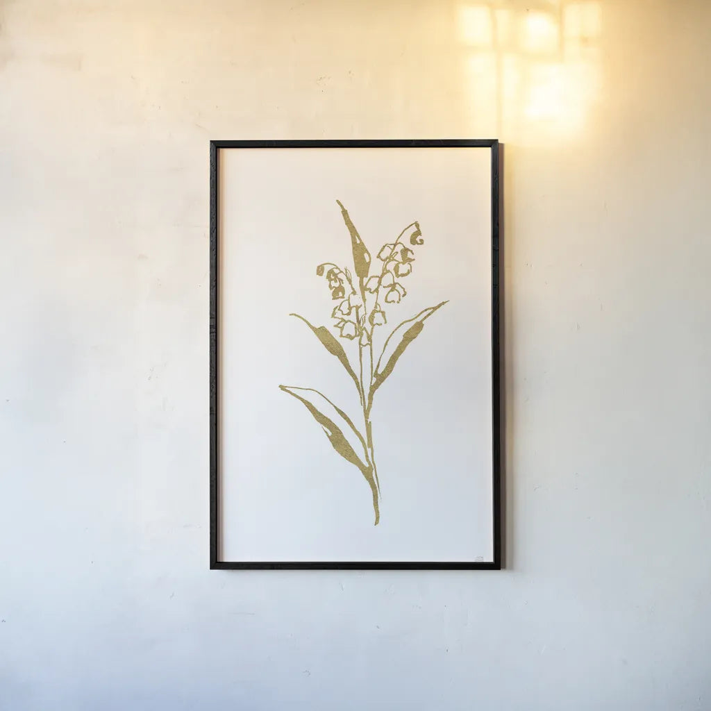 Gold Line Lily of the Valley II by Chris Paschke. shown as a paper print in a black flame. Available as a archival giclee rolled canvas, fine art paper, or poster print. SKU 69567h.