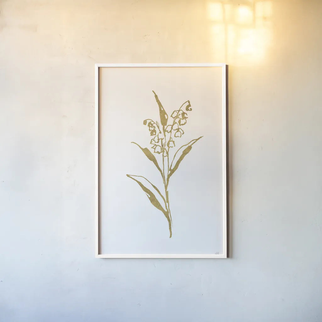 Gold Line Lily of the Valley II by Chris Paschke. shown as a paper print in a white frame. Available as a archival giclee rolled canvas, fine art paper, or poster print. SKU 69567h.