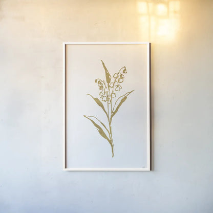 Gold Line Lily of the Valley II by Chris Paschke. shown as a paper print in a white frame. Available as a archival giclee rolled canvas, fine art paper, or poster print. SKU 69567h.