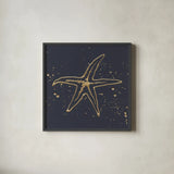 Gold Starfish I by Chris Paschke. Shown in a sleek black glass frame for a contemporary gallery look. Available as an archival giclee rolled canvas, fine art paper, or poster print. SKU 69361a.