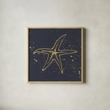 Gold Starfish I by Chris Paschke. Shown in a natural wood glass frame for a timeless modern aesthetic. Available as an archival giclee rolled canvas, fine art paper, or poster print. SKU 69361a.