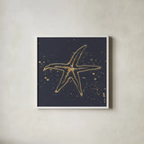 Gold Starfish I by Chris Paschke. Shown in a crisp white glass frame for a clean and minimalist style. Available as an archival giclee rolled canvas, fine art paper, or poster print. SKU 69361a.