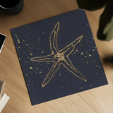 Gold Starfish II by Chris Paschke. Shown as a detailed flat fine art print, highlighting archival giclee quality. Available as an archival giclee rolled canvas, fine art paper, or poster print. SKU 69362a.