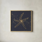 Gold Starfish II by Chris Paschke. Shown in a natural wood glass frame for a timeless modern aesthetic. Available as an archival giclee rolled canvas, fine art paper, or poster print. SKU 69362a.
