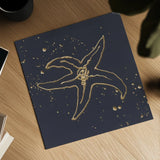 Gold Starfish III by Chris Paschke. Shown as a detailed flat fine art print, highlighting archival giclee quality. Available as an archival giclee rolled canvas, fine art paper, or poster print. SKU 69363a.