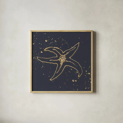 Gold Starfish III by Chris Paschke. Shown in a natural wood glass frame for a timeless modern aesthetic. Available as an archival giclee rolled canvas, fine art paper, or poster print. SKU 69363a.