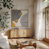 Golden Orbs III by Chris Paschke. Shown in a natural wood frame in a cozy modern living room. Available as an archival giclee rolled canvas, fine art paper, or poster print. SKU 88080a.