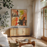 Graffiti Orange II by Chris Paschke. Shown in a natural wood frame in a cozy modern living room. Available as an archival giclee rolled canvas, fine art paper, or poster print. SKU 44543a.