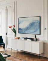 In the Blue V by Chris Paschke. shown as a framed stretched canvas in a living room above a console. Available as a archival giclee rolled canvas, fine art paper, or poster print. SKU 61473i.