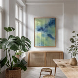 Indigo Flow I by Chris Paschke. shown as a print in a natural wood frame in a dining room. Available as a archival giclee rolled canvas, fine art paper, or poster print. SKU 49049h.