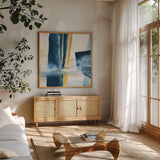 Indigo IV by Chris Paschke. Shown in a natural wood frame in a cozy modern living room. Available as an archival giclee rolled canvas, fine art paper, or poster print. SKU 15136a.