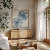 Indigo Mint II by Chris Paschke. Shown in a natural wood frame in a cozy modern living room. Available as an archival giclee rolled canvas, fine art paper, or poster print. SKU 33999a.