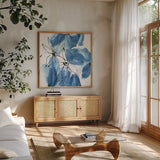 Indigo Neutrals II by Chris Paschke. Shown in a natural wood frame in a cozy modern living room. Available as an archival giclee rolled canvas, fine art paper, or poster print. SKU 70652a.