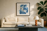 Indigo Neutrals II by Chris Paschke. Displayed in a glass frame with matte in a clean modern living room. Available as an archival giclee rolled canvas, fine art paper, or poster print. SKU 70652a.