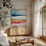 Jewel Waterway III by Chris Paschke. Shown in a natural wood frame in a cozy modern living room. Available as an archival giclee rolled canvas, fine art paper, or poster print. SKU 80129a.