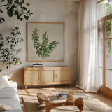 Kozo Fern IV by Chris Paschke. Shown in a natural wood frame in a cozy modern living room. Available as an archival giclee rolled canvas, fine art paper, or poster print. SKU 95417a.