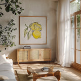 Lemon Still Life II by Chris Paschke. Shown in a natural wood frame in a cozy modern living room. Available as an archival giclee rolled canvas, fine art paper, or poster print. SKU 66881a.