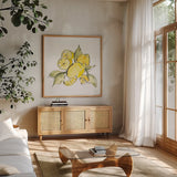 Lemon Still Life III by Chris Paschke. Shown in a natural wood frame in a cozy modern living room. Available as an archival giclee rolled canvas, fine art paper, or poster print. SKU 66882a.