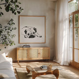 Line Dog Pug II by Chris Paschke. Shown in a natural wood frame in a cozy modern living room. Available as an archival giclee rolled canvas, fine art paper, or poster print. SKU 63555a.
