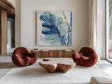 Luxe Banana Leaf I by Chris Paschke. Shown as extra-large giant wall art in a modern living room. Available as an archival giclee rolled canvas, fine art paper, or poster print. SKU 84576a.