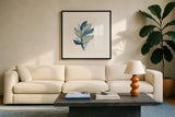 Luxe Leaf III by Chris Paschke. Displayed in a glass frame with matte in a clean modern living room. Available as an archival giclee rolled canvas, fine art paper, or poster print. SKU 84574a.