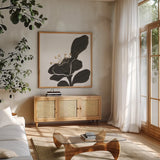 Mod Poppy II by Chris Paschke. Shown in a natural wood frame in a cozy modern living room. Available as an archival giclee rolled canvas, fine art paper, or poster print. SKU 98230a.