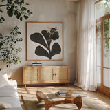 Mod Poppy III by Chris Paschke. Shown in a natural wood frame in a cozy modern living room. Available as an archival giclee rolled canvas, fine art paper, or poster print. SKU 98231a.