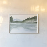 Mountain Lake by Chris Paschke. shown as a paper print in a white frame. Available as a archival giclee rolled canvas, fine art paper, or poster print. SKU 83111i.