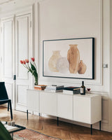 Neutral Vases III by Chris Paschke. shown as a framed stretched canvas in a living room above a console. Available as a archival giclee rolled canvas, fine art paper, or poster print. SKU 75664i.