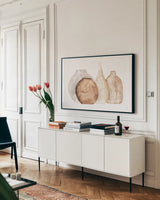 Neutral Vases IV by Chris Paschke. shown as a framed stretched canvas in a living room above a console. Available as a archival giclee rolled canvas, fine art paper, or poster print. SKU 75665i.