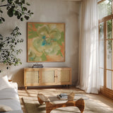 Olive Poppy I by Chris Paschke. Shown in a natural wood frame in a cozy modern living room. Available as an archival giclee rolled canvas, fine art paper, or poster print. SKU 50259a.