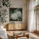 Peonies on Black I by Chris Paschke. Shown in a natural wood frame in a cozy modern living room. Available as an archival giclee rolled canvas, fine art paper, or poster print. SKU 80807a.