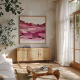 Pinkscape II by Chris Paschke. Shown in a natural wood frame in a cozy modern living room. Available as an archival giclee rolled canvas, fine art paper, or poster print. SKU 66757a.