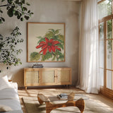 Poinsettia I by Chris Paschke. Shown in a natural wood frame in a cozy modern living room. Available as an archival giclee rolled canvas, fine art paper, or poster print. SKU 44518a.