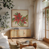 Poinsettia II by Chris Paschke. Shown in a natural wood frame in a cozy modern living room. Available as an archival giclee rolled canvas, fine art paper, or poster print. SKU 44519a.