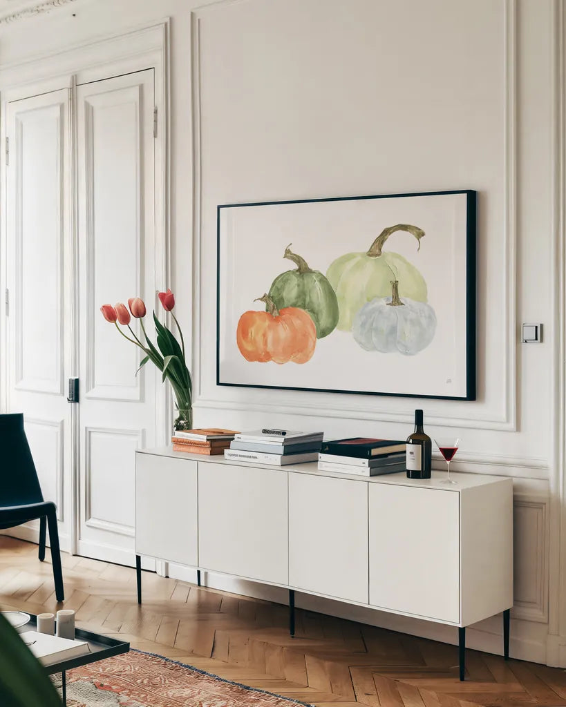 Pumpkin Menagerie II by Chris Paschke. shown as a framed stretched canvas in a living room above a console. Available as a archival giclee rolled canvas, fine art paper, or poster print. SKU 81881i.