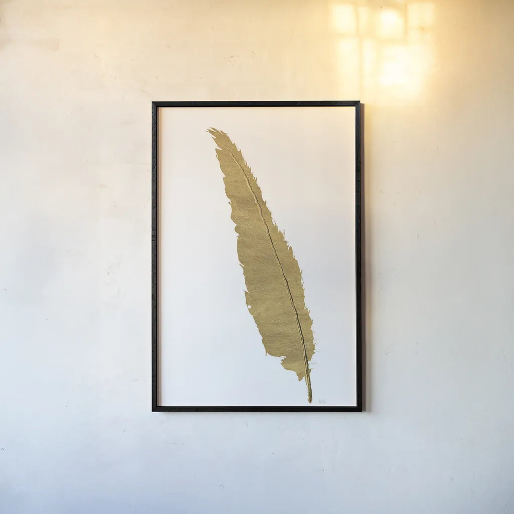 Pure Gold Feather VI by Chris Paschke. shown as a paper print in a black flame. Available as a archival giclee rolled canvas, fine art paper, or poster print. SKU 28004h.