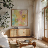 Rainbow Cosmos II by Chris Paschke. Shown in a natural wood frame in a cozy modern living room. Available as an archival giclee rolled canvas, fine art paper, or poster print. SKU 24354a.