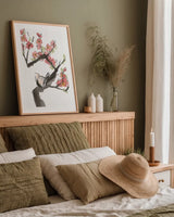 Red Plum Branch I by Chris Paschke. shown as a paper print in a natural frame. Available as a archival giclee rolled canvas, fine art paper, or poster print. SKU 100168h.